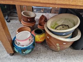 Various ceramic planters including terracotta, glazed, etc.