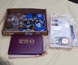 A box of UK coins including coin sets, commemorative coins, crowns, etc.