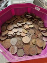 A tub of coins, mostly UK, some world coins.