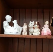 A group of porcelain ornaments including two Beswick dogs, a Royal Doulton dog and a Royal Doulotn