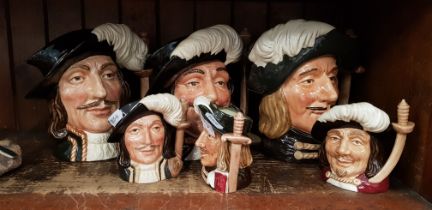 Two sets of Royal Doulton 'Three Musketeers' toby jugs, one large set and one small.