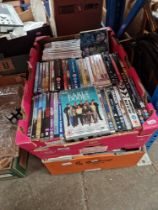 Two boxes of DVDs, VHS, etc.
