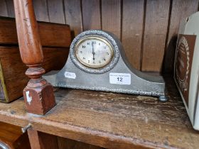 A Tudric pewter mantle clock.