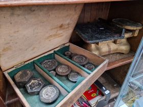 A set of vintage Avery scales together with a box of weights.