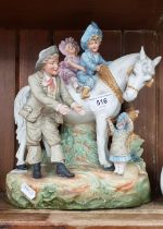 A Heubach bisque figure group 'Lift me up Daddy', height 26.5cm