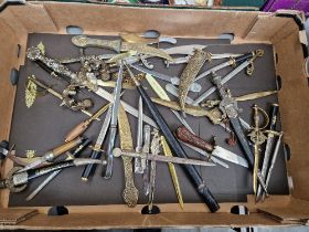 A box of assorted eastern daggers & letter openers etc.