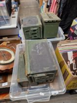Seven army metal boxes.
