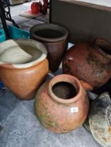 4 medium sized terracotta planters