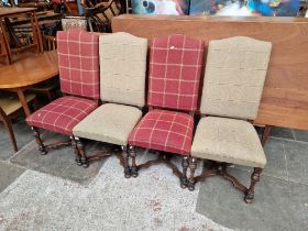 A set of four oak framed dining chairs.