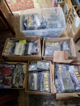 A large collection of Batman automobilia model vehicles, boxed with magazines (un-opened).