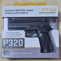 A Sig Sauer P320 .177mm calibre Co2 air pistol, serial no.17F29015, 20cm long, in original....