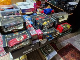 Three boxes of assorted boxed model vehicles to include Burago cars, Guiloy motorbike, Maisto