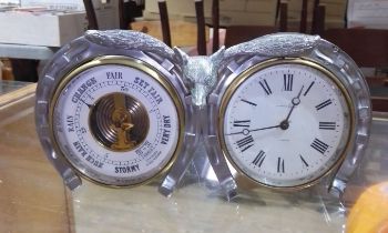 A Mapin & Webb barometer and clock with fox and horse shoe surround, length 26cm.