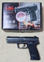 A Heckler & Koch .177 calibre Co2 USP air pistol, 20cm long, in original box with manual...