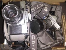 Two Praktica MTL-5B cameras with cases, spare lens and accessories.