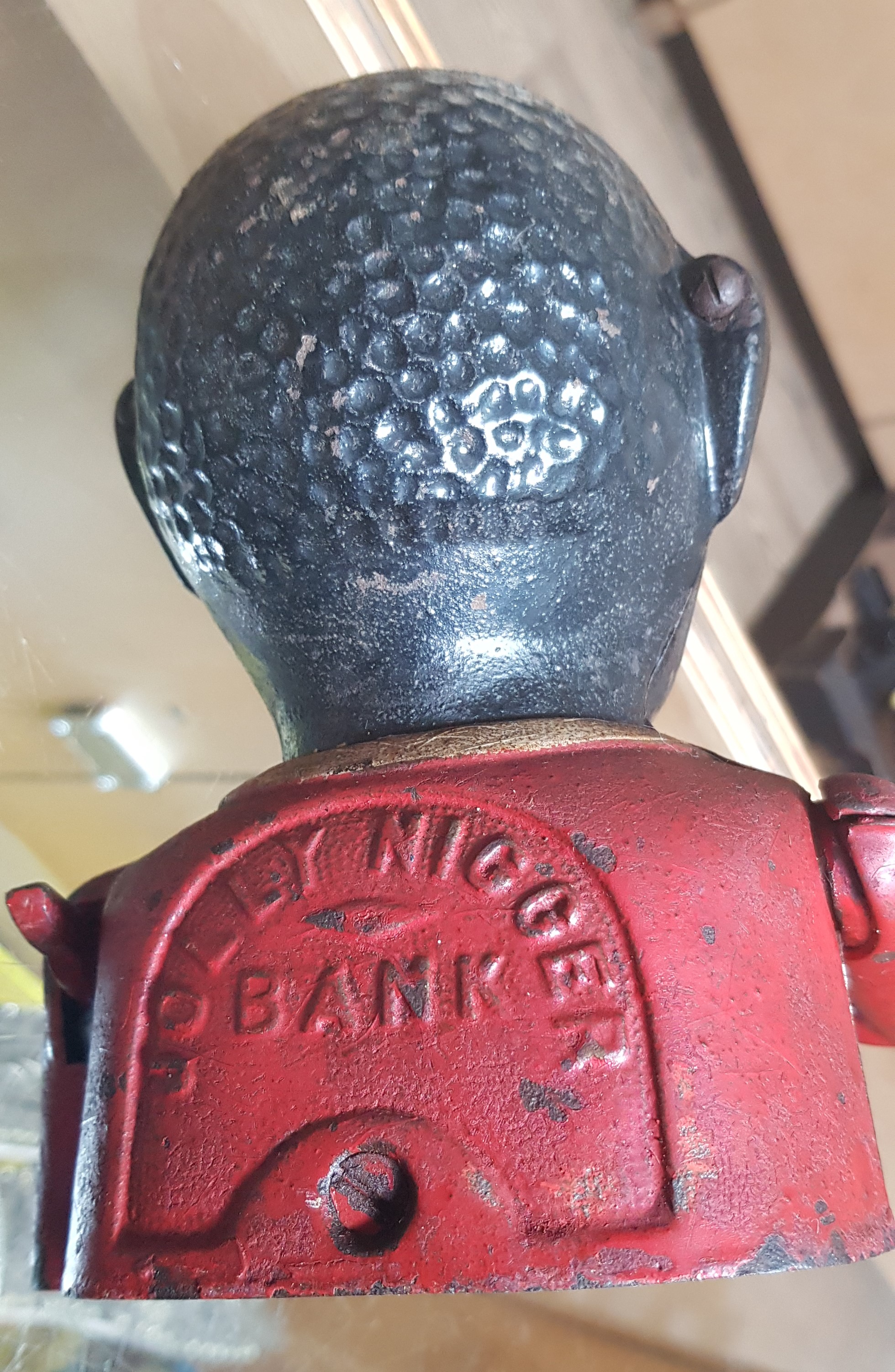 A cast metal money bank. Note:- These items are listed on the basis they are illustrative of a - Image 2 of 3