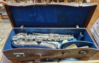 A silver plated Alto saxophone in case.