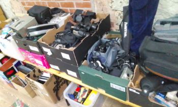 Seven boxes of assorted camera equipment and binoculars.
