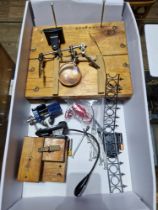 A box of model making tools and equipment including clamps, clips, screwdrivers, magnifying glass,