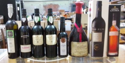 Eight bottles comprising two bottles of Cossart Gordon Madeira, two other bottles of Madeira, Marc