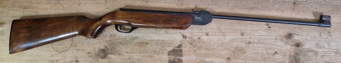 A Baikal .177 calibre break barrel air rifle, serial no.90046265, 102cm long, with tin of