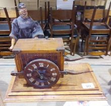 A novelty automaton clock, modelled as an organ cart operated by a carved wood man, on platform