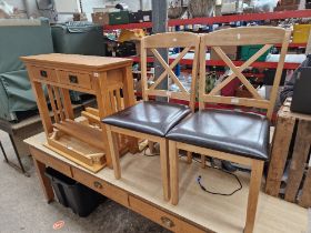 A modern light oak side table together with a kitchen dining and two chairs.