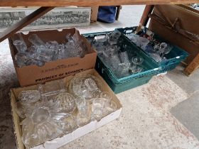 Four boxes of assorted glass.