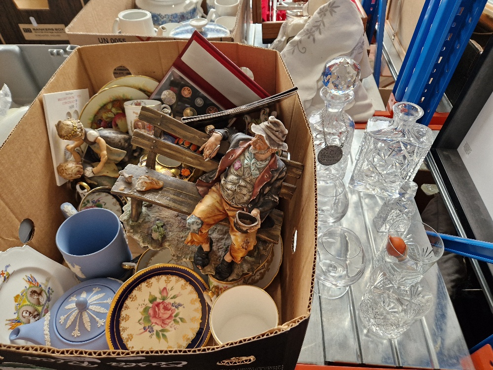 A mixed lot comprising Wedgwood jasperware, Capodimonte figure, crystal glassware, coin sets,