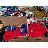 Three boxes of assorted rugby, cricket and other sporting jerseys.