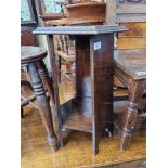 An Arts & Crafts oak occasional table/plant stand, label for Pioneer Stores, Liverpool to underside.