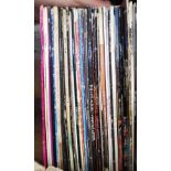 A box of vinyl LP records, rock and pop including Tina Turner, Deacon Blue, The Police, etc.