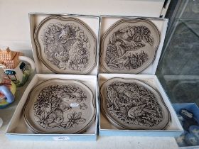 Poole ‘The Four Seasons’ - a set of 4 wall plaques with raised decoration by Barbara Linley-Adams,