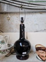 A Chinese mirror black globular vase lamp.