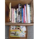 A box of tea card albums, loose tea cards, and train related postcards and a box of books.