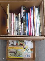 A box of tea card albums, loose tea cards, and train related postcards and a box of books.