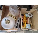 Two boxes of assorted items including glass and brass light fittings, a Pelham pirate puppet...