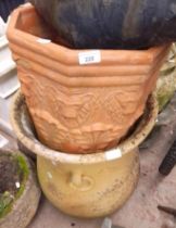 2 large terra cotta planters, one octagonal and one urn shape