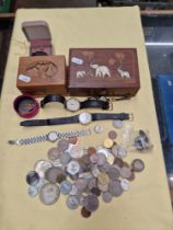 Coins and some watches and a brooch