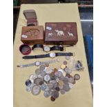 Coins and some watches and a brooch