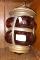 A ship's or carriage lantern with coloured glass.