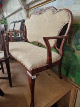 An early 20th century mahogany framed two seater settee. Condition- repair to back where it has