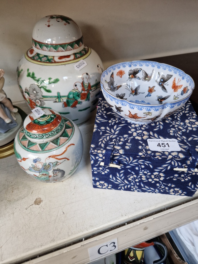 Two Chinese ginger jars together with a boxed Japanese ceramic bowl decorated with butterflies
