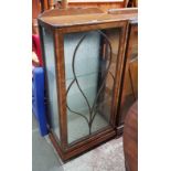 A 1930s Art Deco walnut display cabinet.