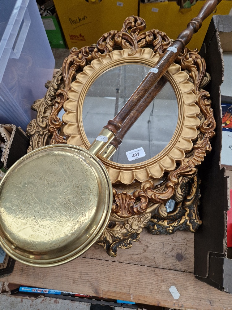 four ornate mirrors and a bed warming pan.