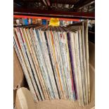 A box of classical vinyl LP records.