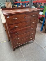 A 1930s Art Deco walnut chest of drawers.