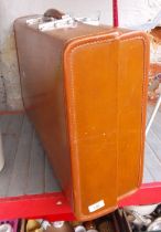 A large vintage Revelation leather suitcase