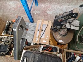 A Black & Decker band saw, a Clarke belt sander and a router.