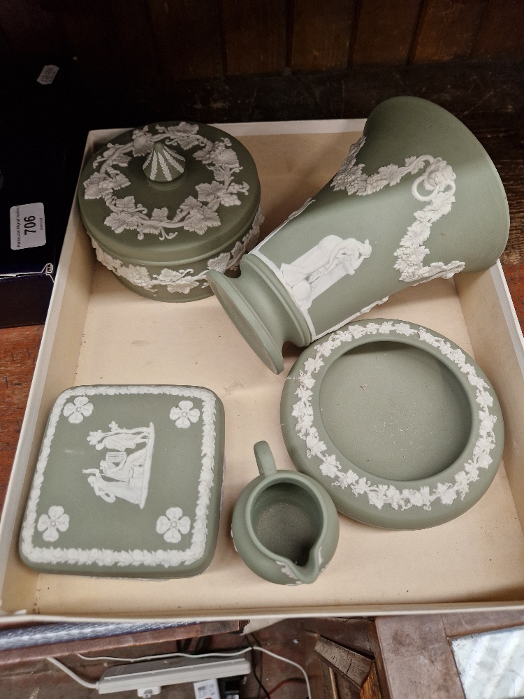 Five pieces of green Wedgwood jasperware including vase, lidded dishes, etc.